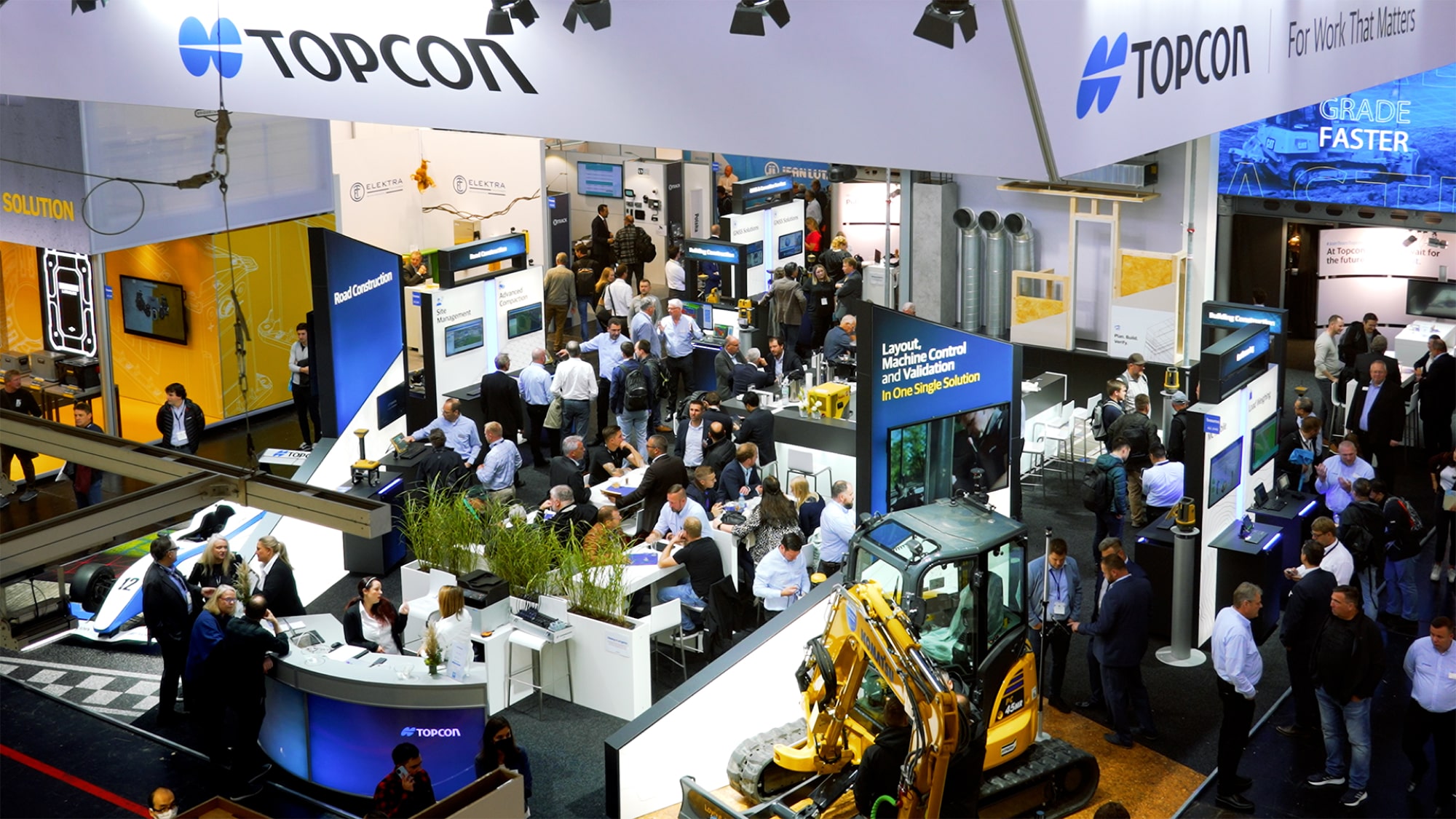 Busy Topcon exhibition stand at a construction trade show