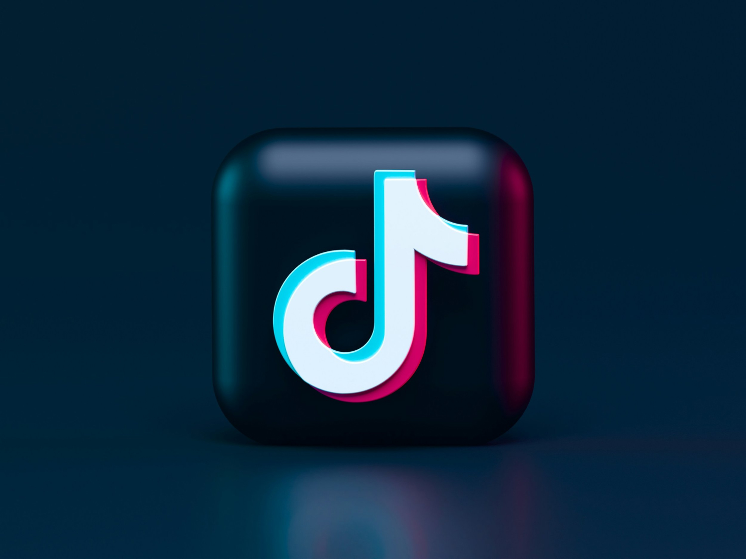TikTok logo on a dark glossy app icon