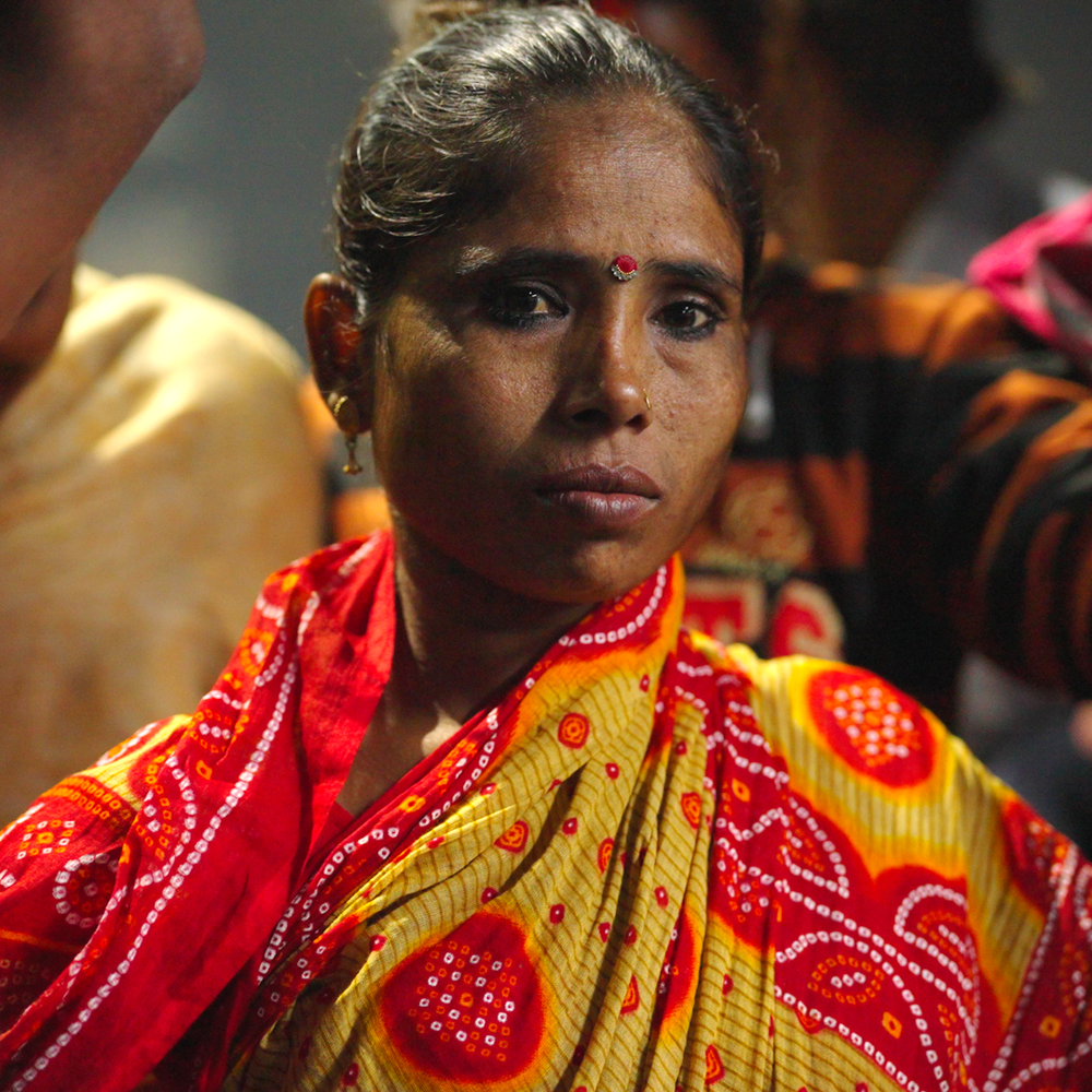 Woman in a red and yellow sari, a still from a Hope Foundation video