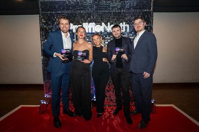 Tangerine team holding awards on the red carpet at the Prolific North Marketing Awards