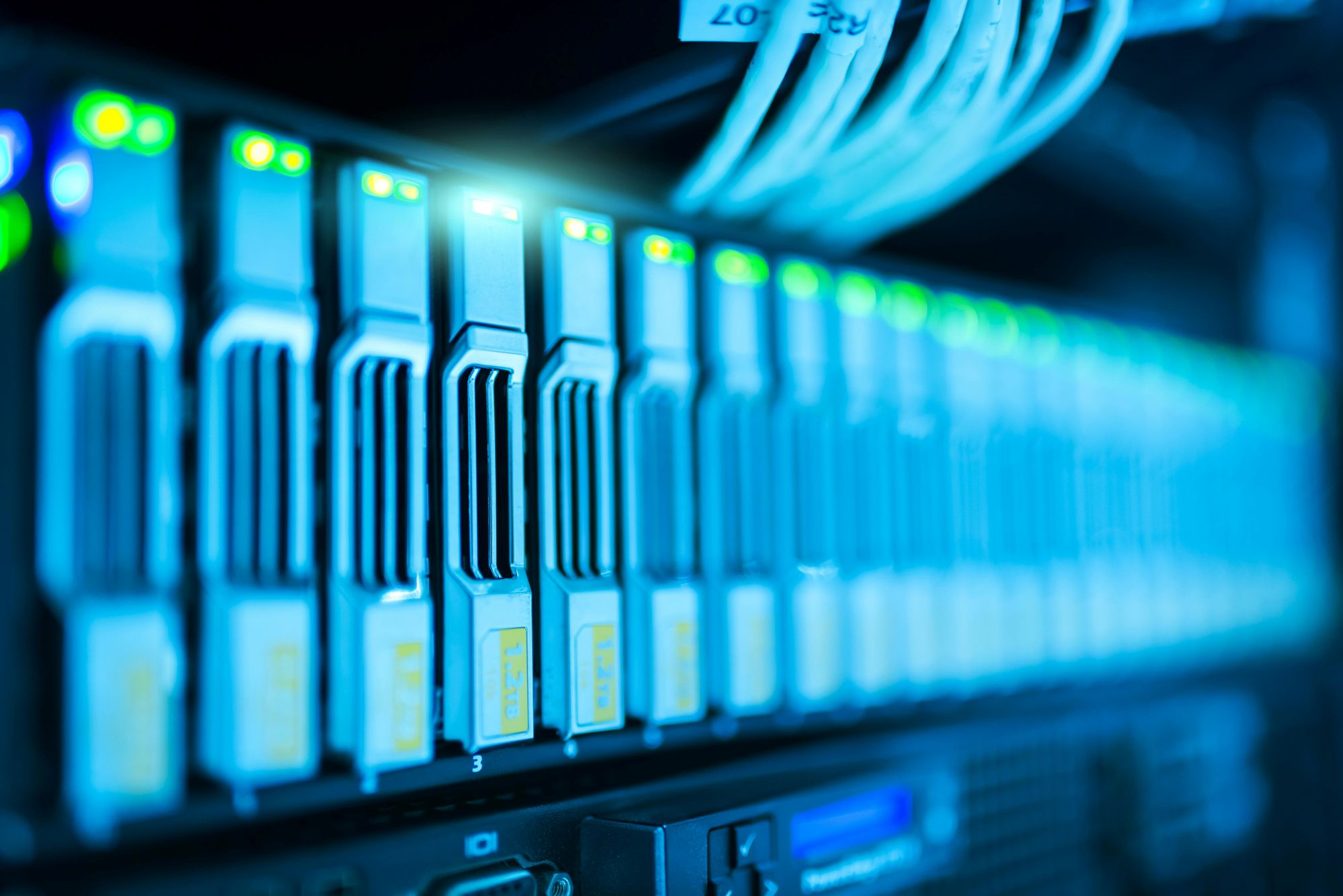 Close-up of network cables and servers in a data centre