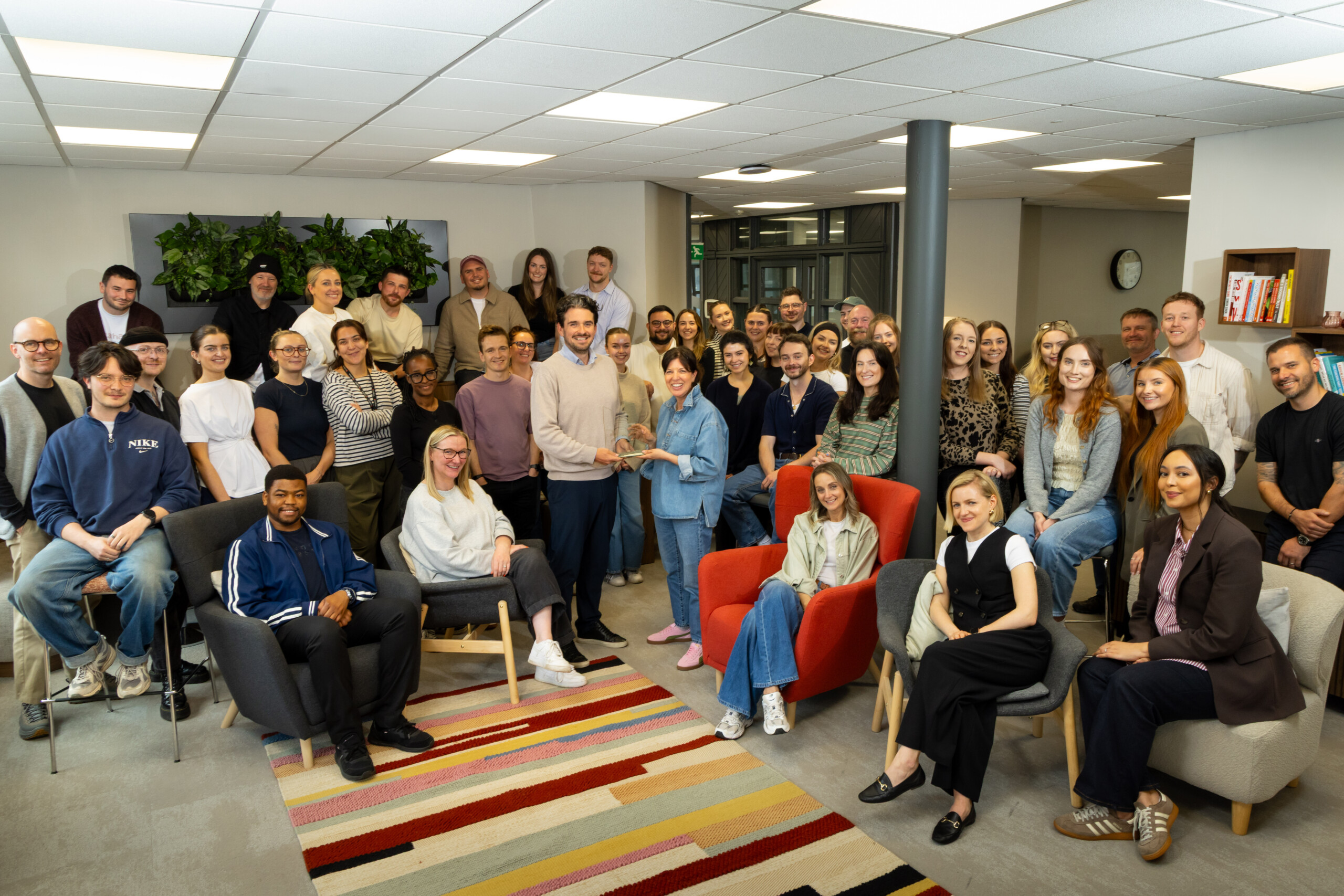 Tangerine team group photo in the office