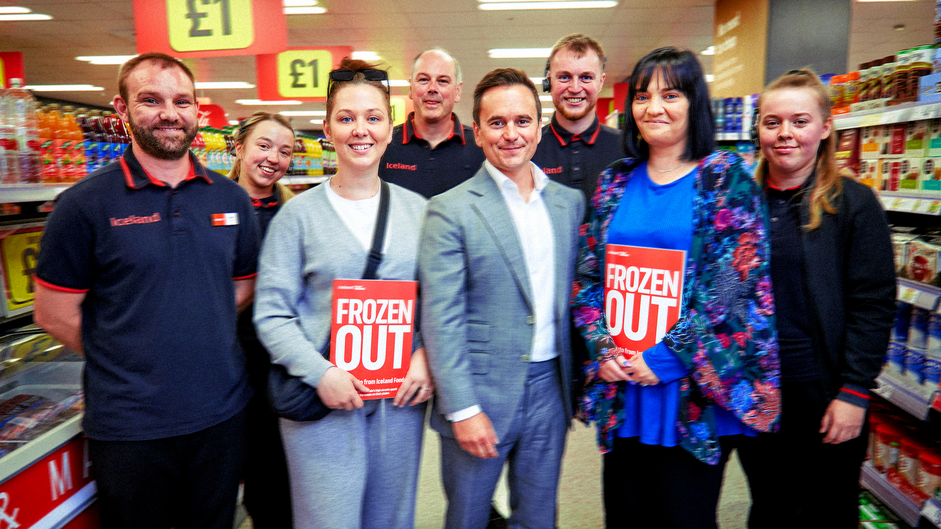 Iceland staff and guests holding copies of the 'Frozen Out' report in store