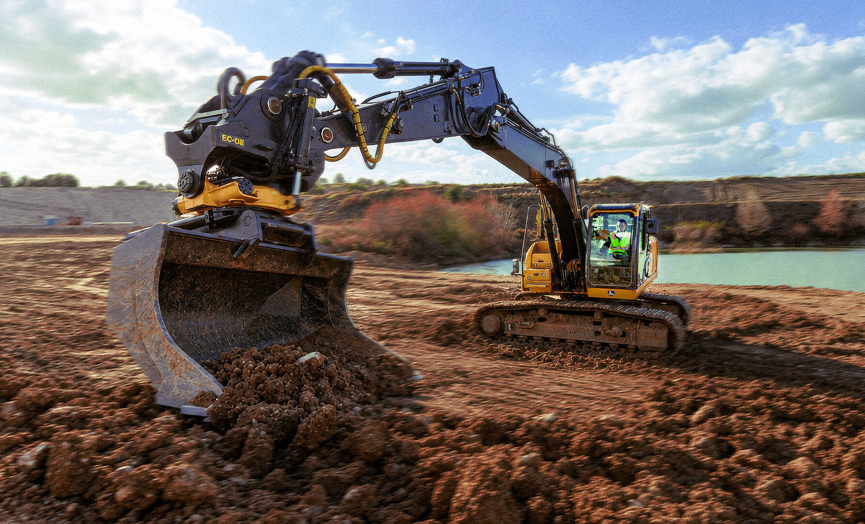 Topcon-equipped excavator digging at a quarry site