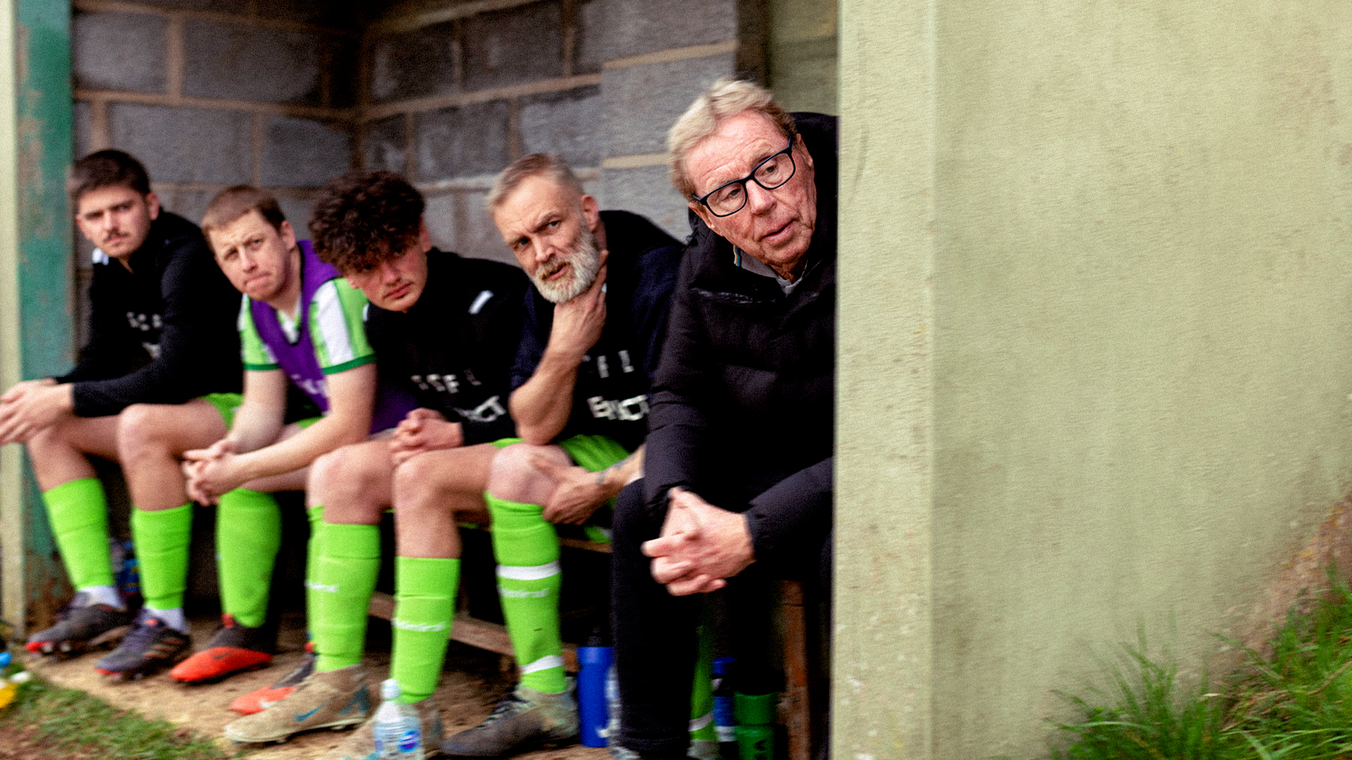 Harry Redknapp sitting in the dugout with grassroots footballers, Specsavers Best Worst Team