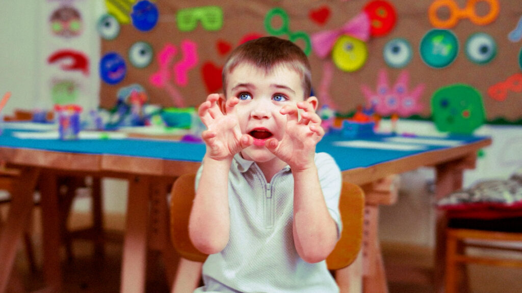 Young child pulling a playful face at a colourful craft table, cover art for the Gen Alpha report