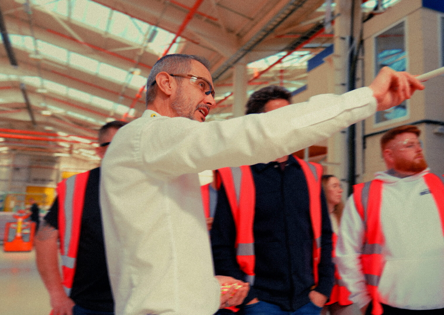 Wavin host pointing out features to plumbers during a factory tour