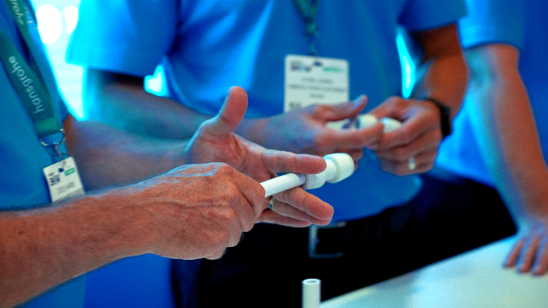 Close-up of hands testing a Hep2O push-fit plumbing fitting